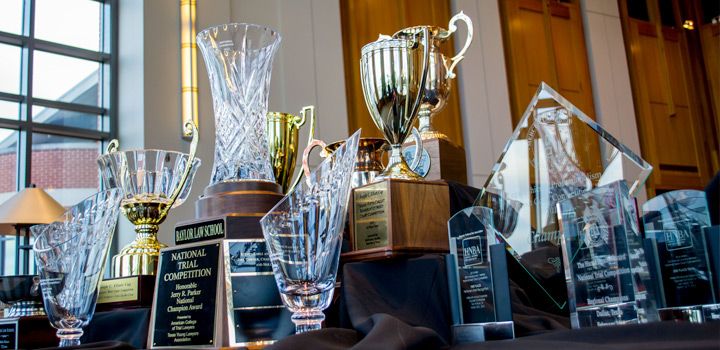 Impressive array of trophies that Baylor Law teams have won.