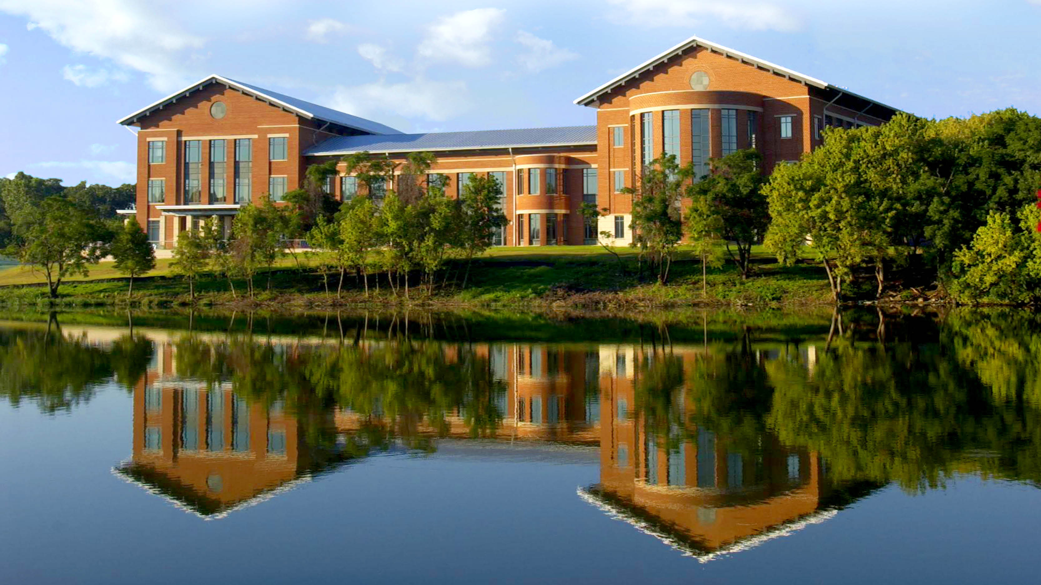 Photo of the Rear of the Umphrey Law Center with the Brazos River in the foreground