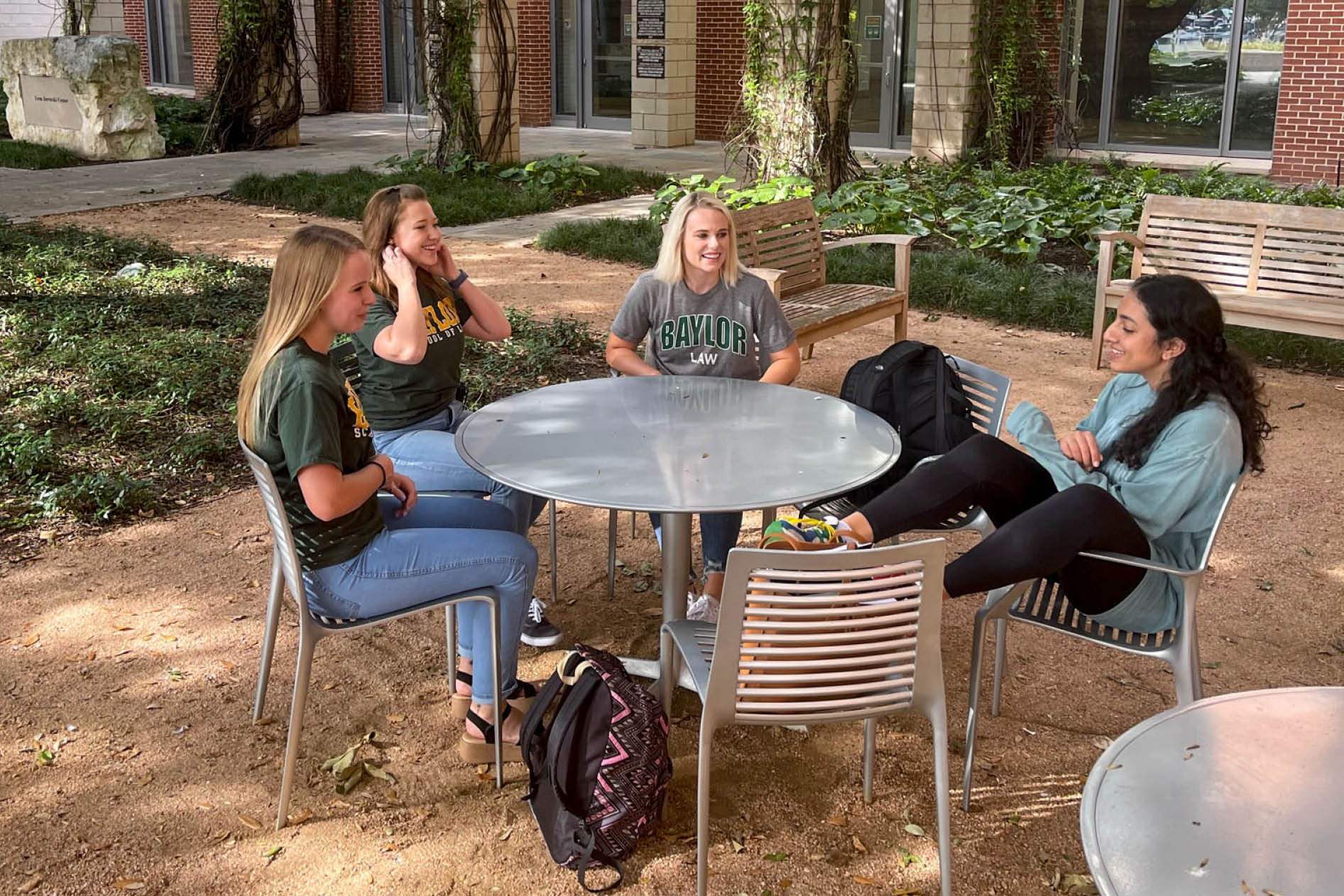 Students in Courtyard at Table