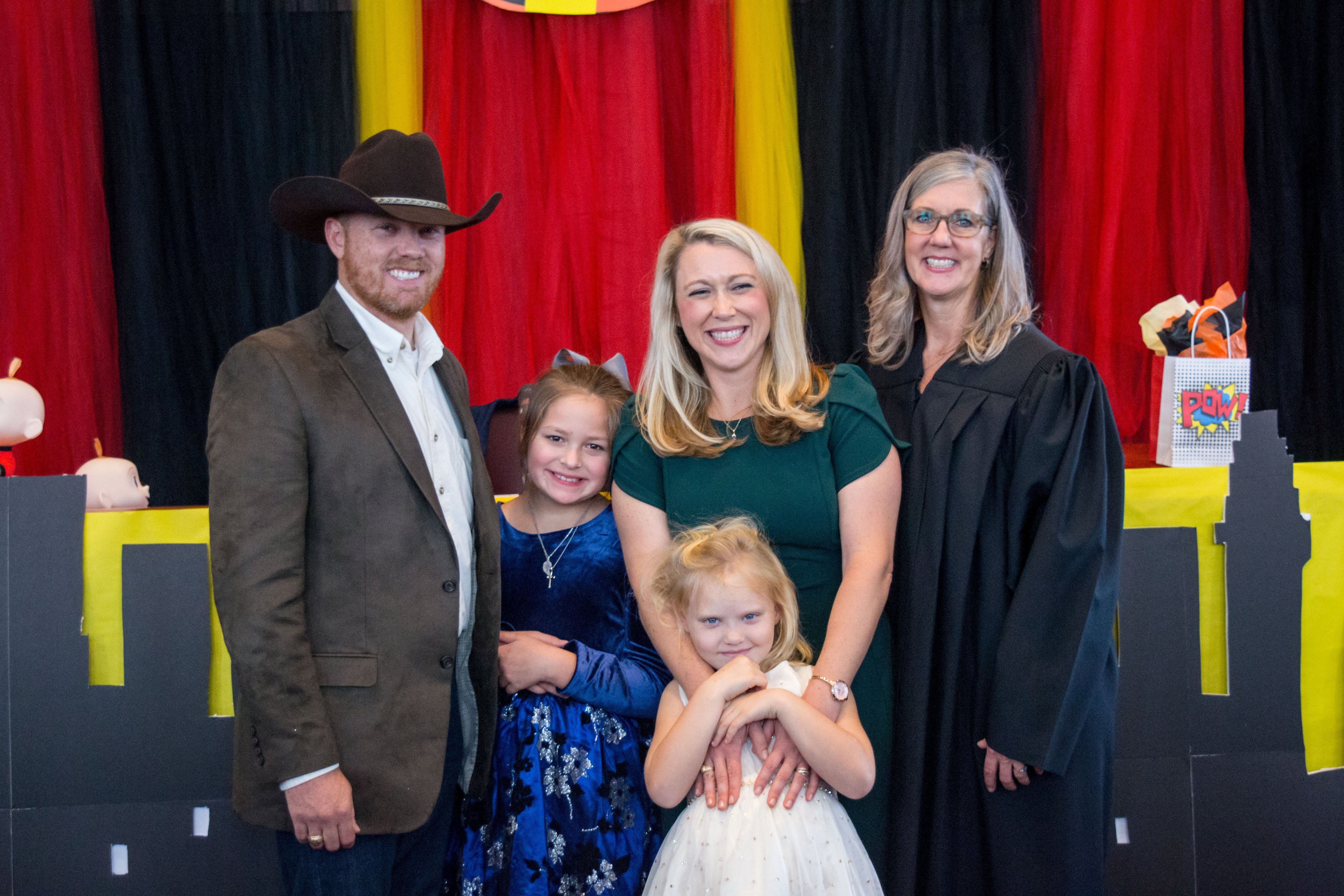 The Hon. Nikki Mundkowsky, associate judge of the Centex Child Protection Court North in Waco, celebrates with Karen and Kyle Melton and their family following the adoption of the Meltons' 10-year-old daughter.