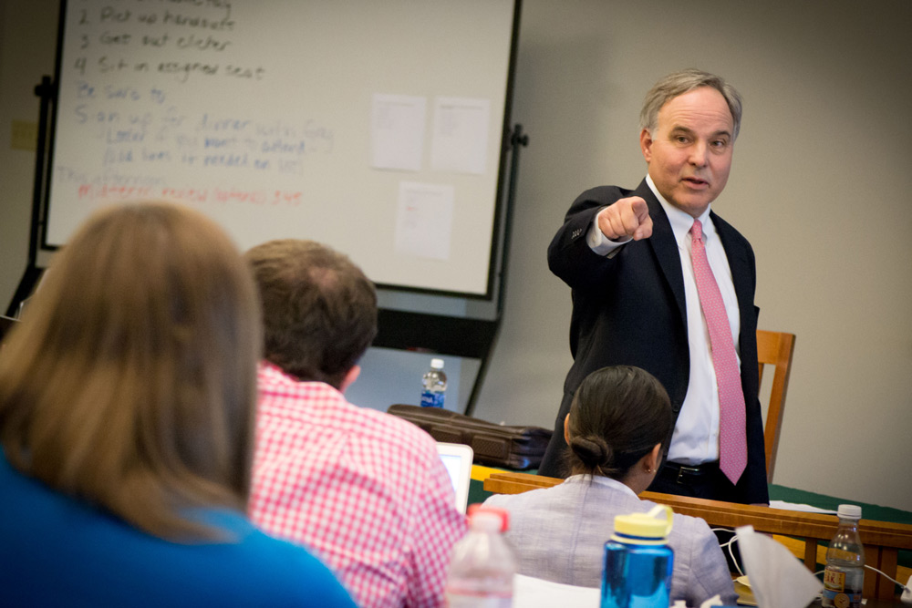 Bill Shaddock, hand extended, makes a point in front of a classroom at Baylor Law during the Business Law Bootcamp