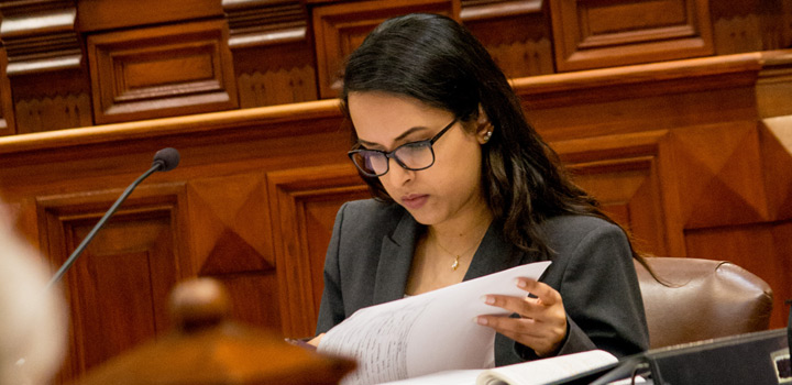 Student reads notes in a courtroom
