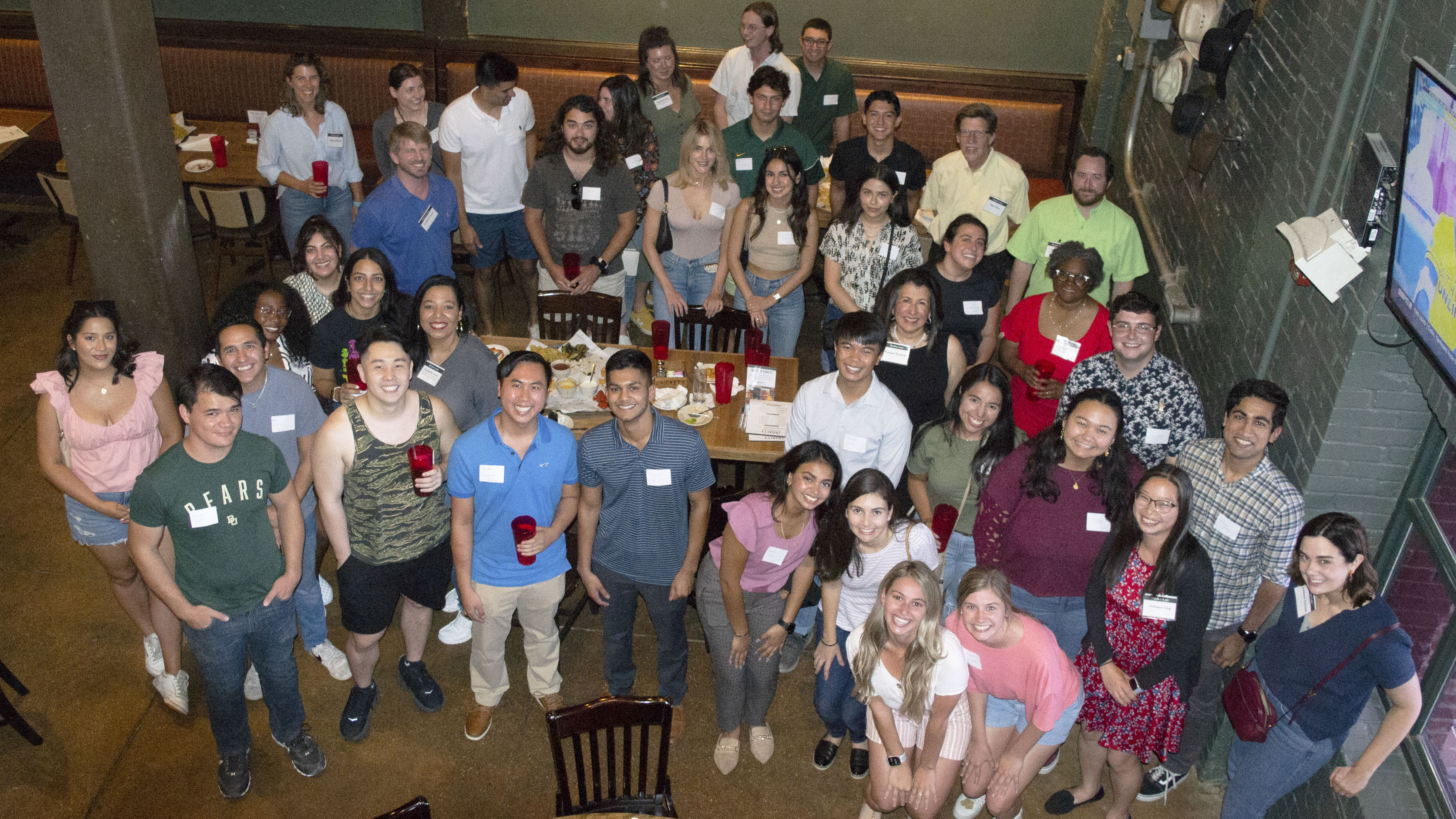 Dozens of students pose at the Diversity in Law welcome dinner