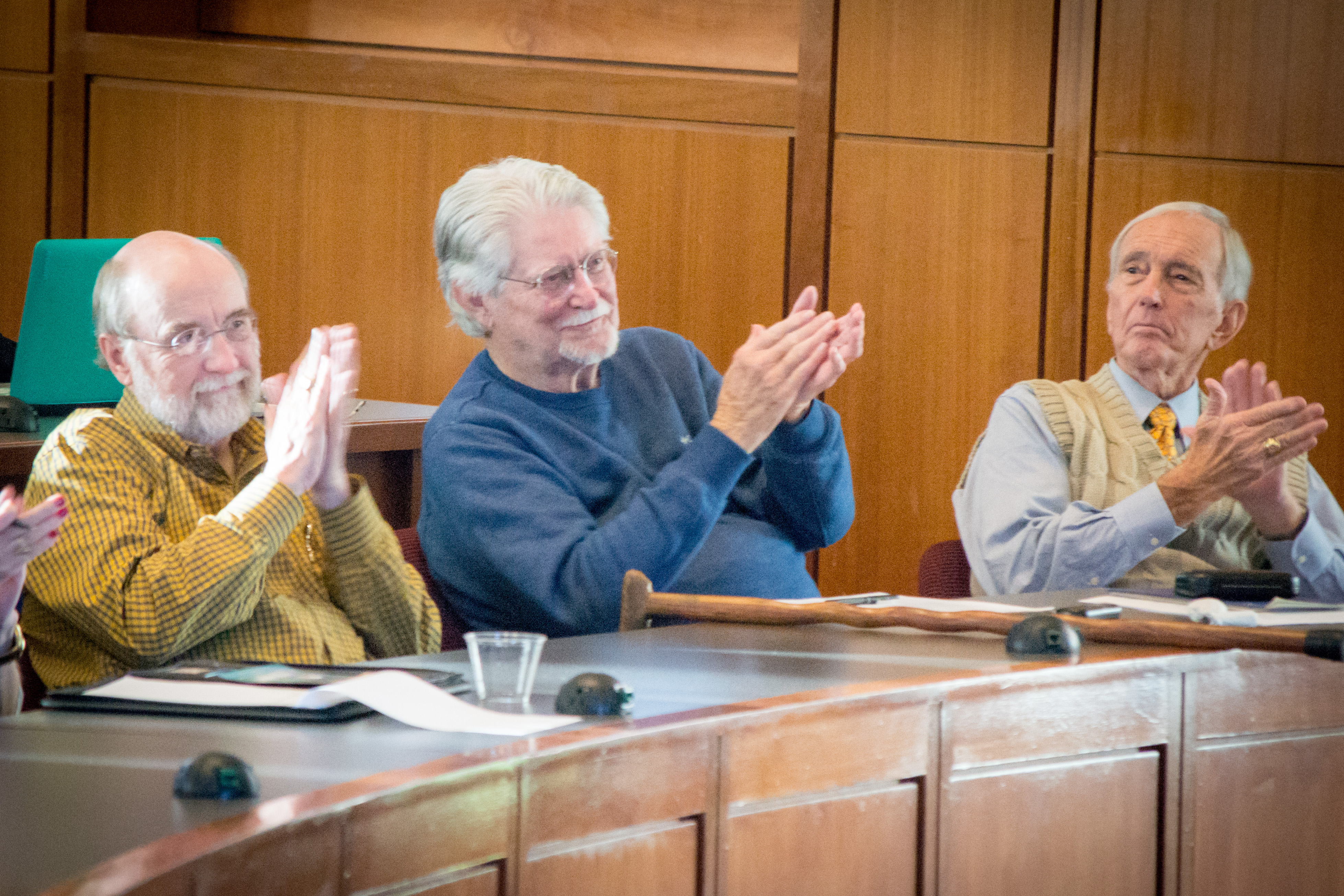 Louis Muldrow, Gerry Powell, and David Guinn, seated as jurors in a Mock Trial, Clapping
