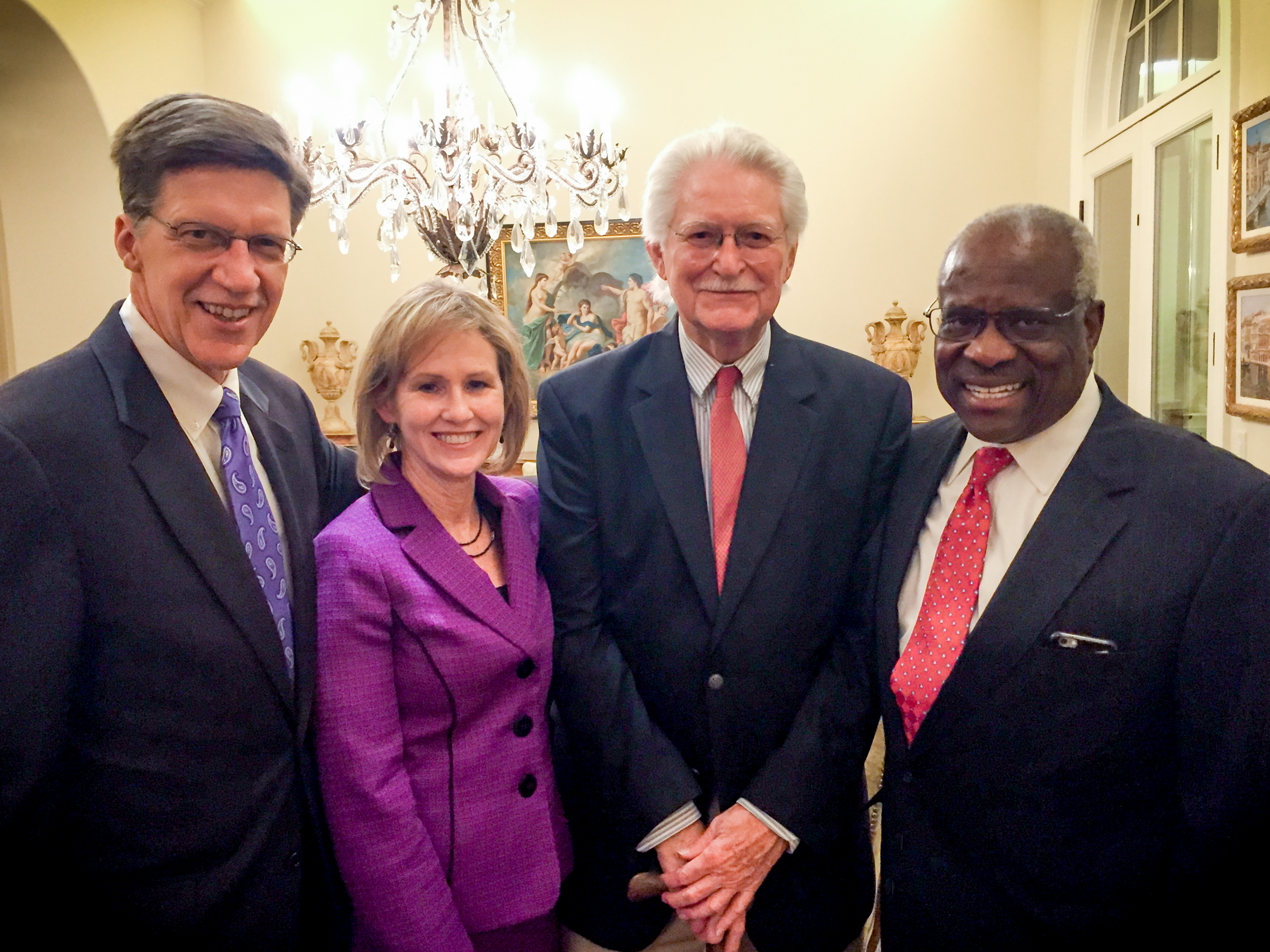 Louis Muldrow poses with Justice Clarence Thomas and Brad Toben and Leah Teague