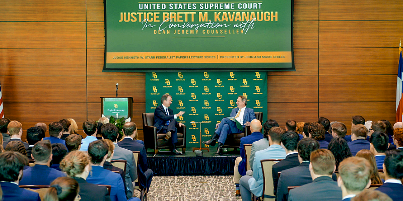 Dean Jeremy Counseller speaks with U.S. Supreme Court Justice Brett M. Kavanaugh at the 2025 Lecture