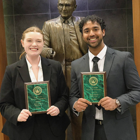 Baylor Law School Students, Meredith Martinez and Vivek George, pose with their awards after the competition