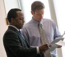 Steve Bolden reviews a document with a student
