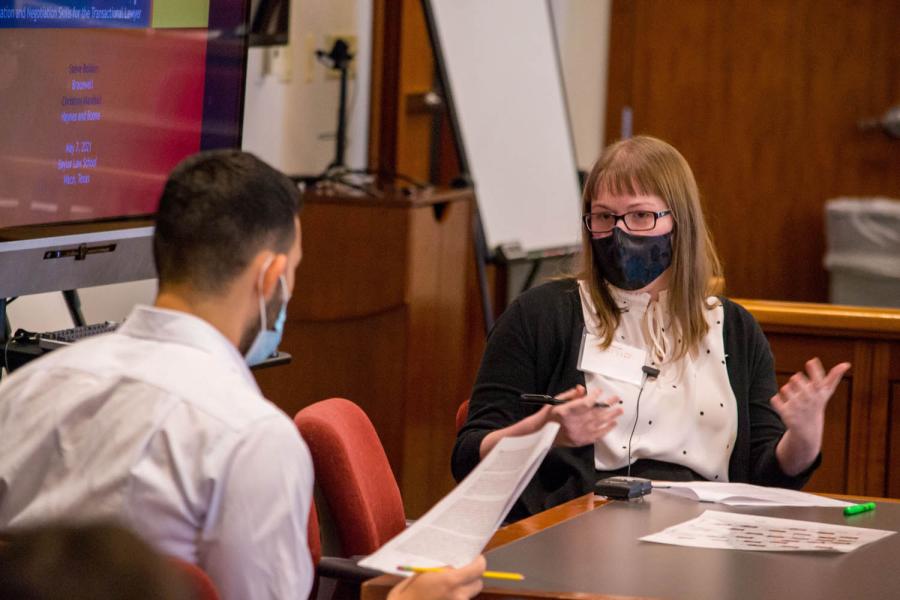 Baylor Law students Steven Ovando and Audrey Edwards participate in a mock negotiation
