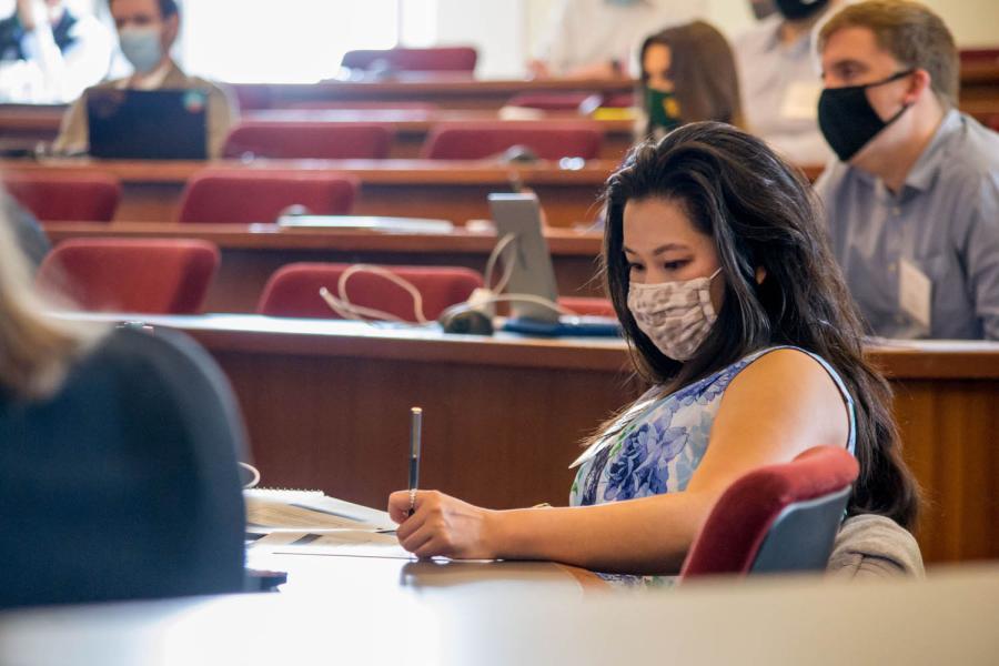 A student takes notes during the 2021 Business Law Boot Camp at Baylor Law School