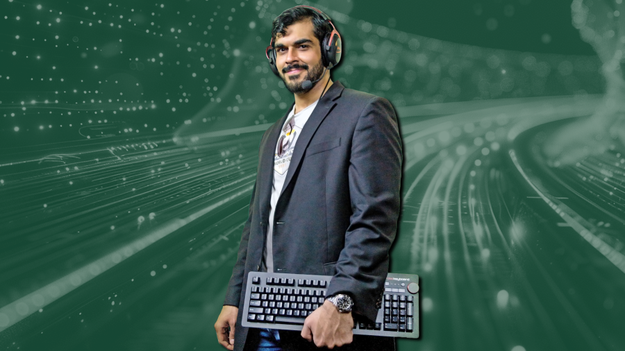 Photo of A.J. Jameel, wearing gaming headset and holding keyboard, superimposed on a dark green background