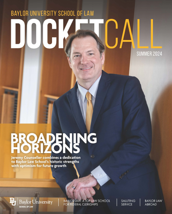 Cover image of the Summer 2024 issue of Docket Call. Dean Jeremy Counseller smiling, leaning on handrail.
