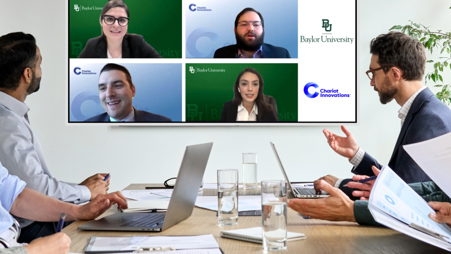 The Finalists of the Closer Competition in 2021 competing virtually on a TV in a small conference room