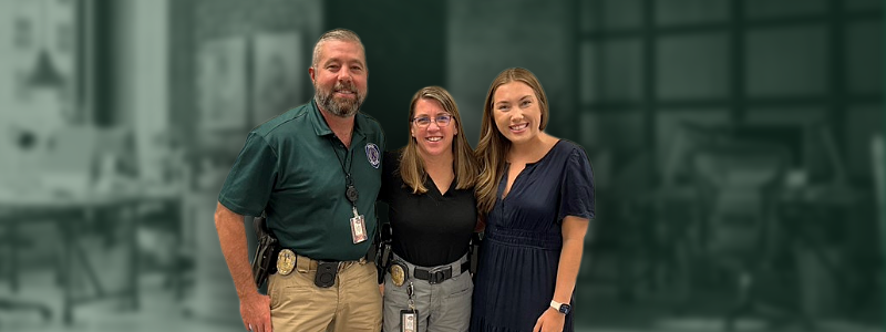 Baylor Law Student Melanie Green poses with Waco PD Detectives at Estate Planning Clinic